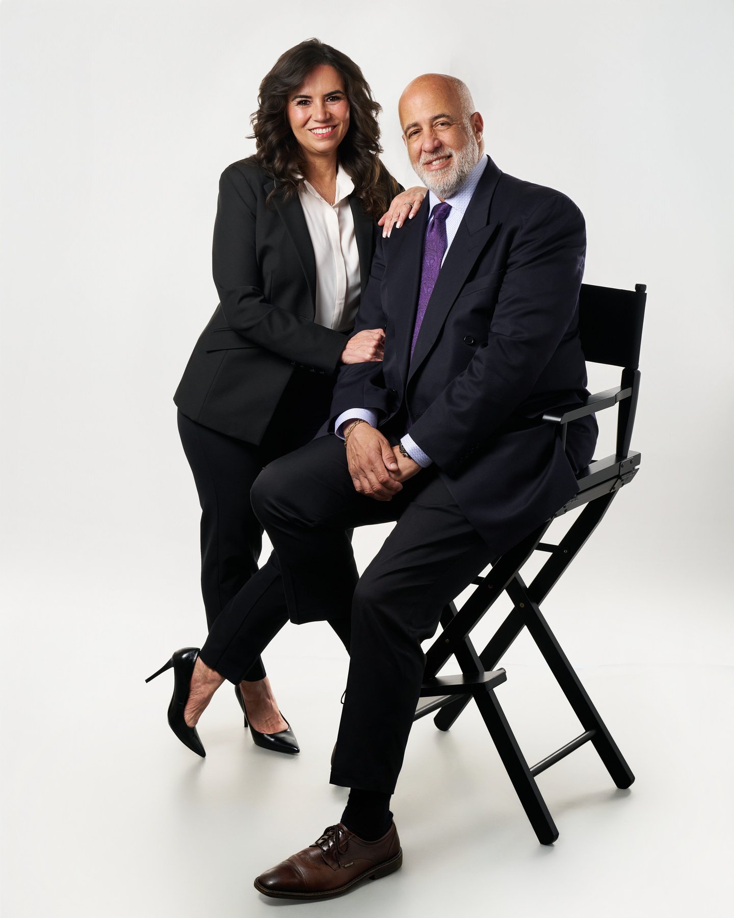 The Branding — full body editorial portrait with chair